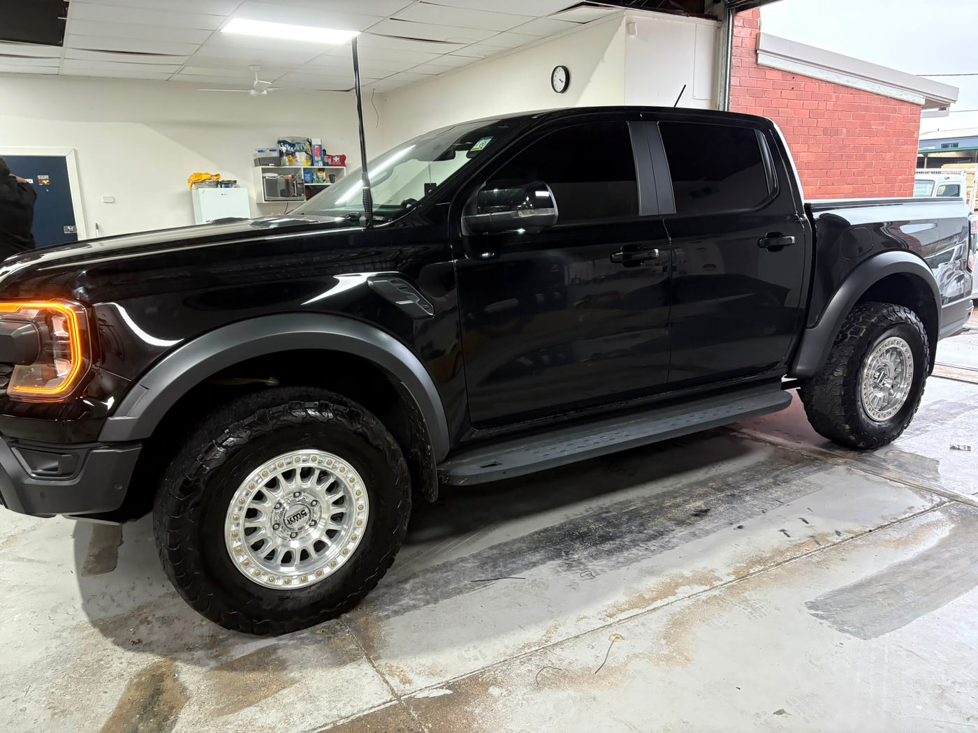 Black Ford Ranger wheel and tyre setup inside the Road Rex 4x4 workshop