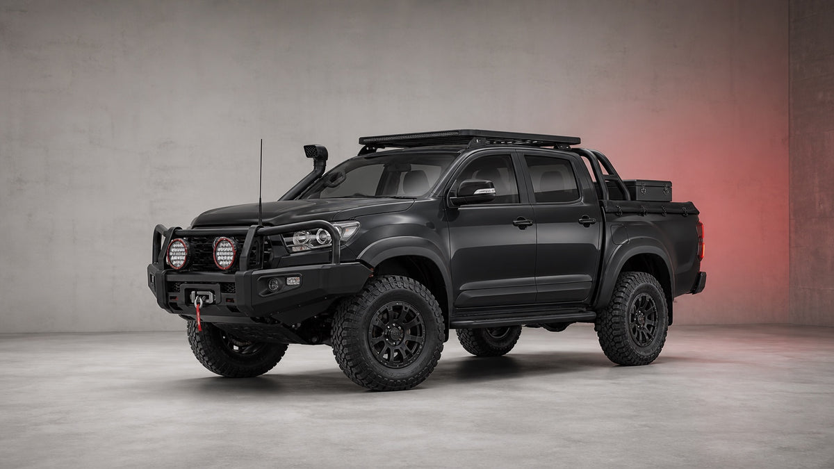 Premium dual-cab 4x4 showing protection, lighting, touring, wheel, suspension and recovery equipment
