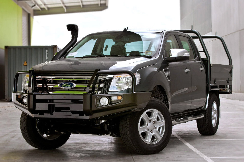 Grey Ford 4x4 with bull bar and tray