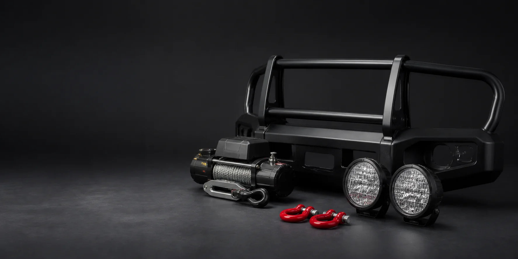 Bull bar, winch, driving lights and recovery points displayed as a protection package