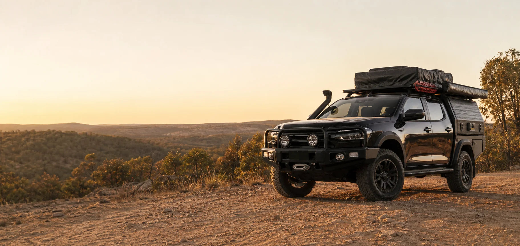 Touring-ready 4x4 with roof platform, awning, rooftop tent and storage